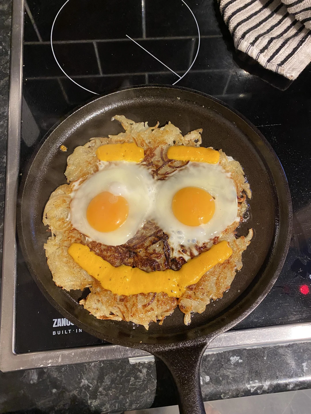 My first ever hash brown. The face made me smile, and the fact that it ...