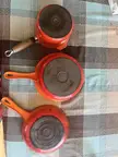 Help! I got these three pans at the thrift store (for $24!). The two saucepans seem to be authentic vintage Le Creuset (dating them is hard without the lid) but the frying pan doesn’t have the normal markings… is it legit?