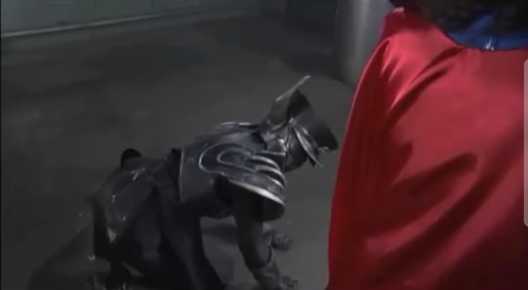 Superheroine choked with own cape 