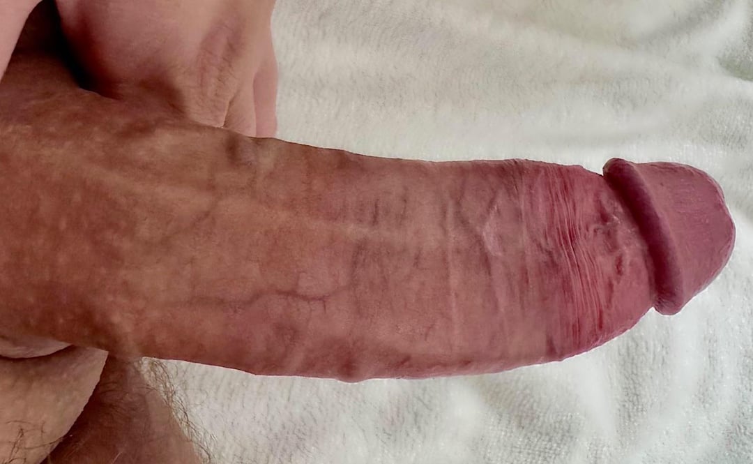 Close-up of a white man's thick, flaccid uncut penis for cock worship.