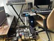 Custom gaming pc build and guitar pedalboard setup with synthesizers and studio monitors