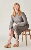 Curvy red head in grey dress &amp; wedge heel sandals