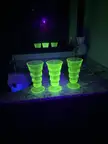 My antique uranium glass under a black light