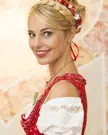 Silvia Schneider Red dirndl with flower crown