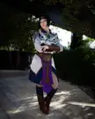 Shadowheart from Baldur's Gate 3 in silver armor and a purple and blue dress