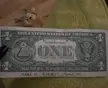 Stripper meme featuring a one-dollar bill with handwritten text 'MAKE IT... STACK IT... SAVE IT!' on green fabric.