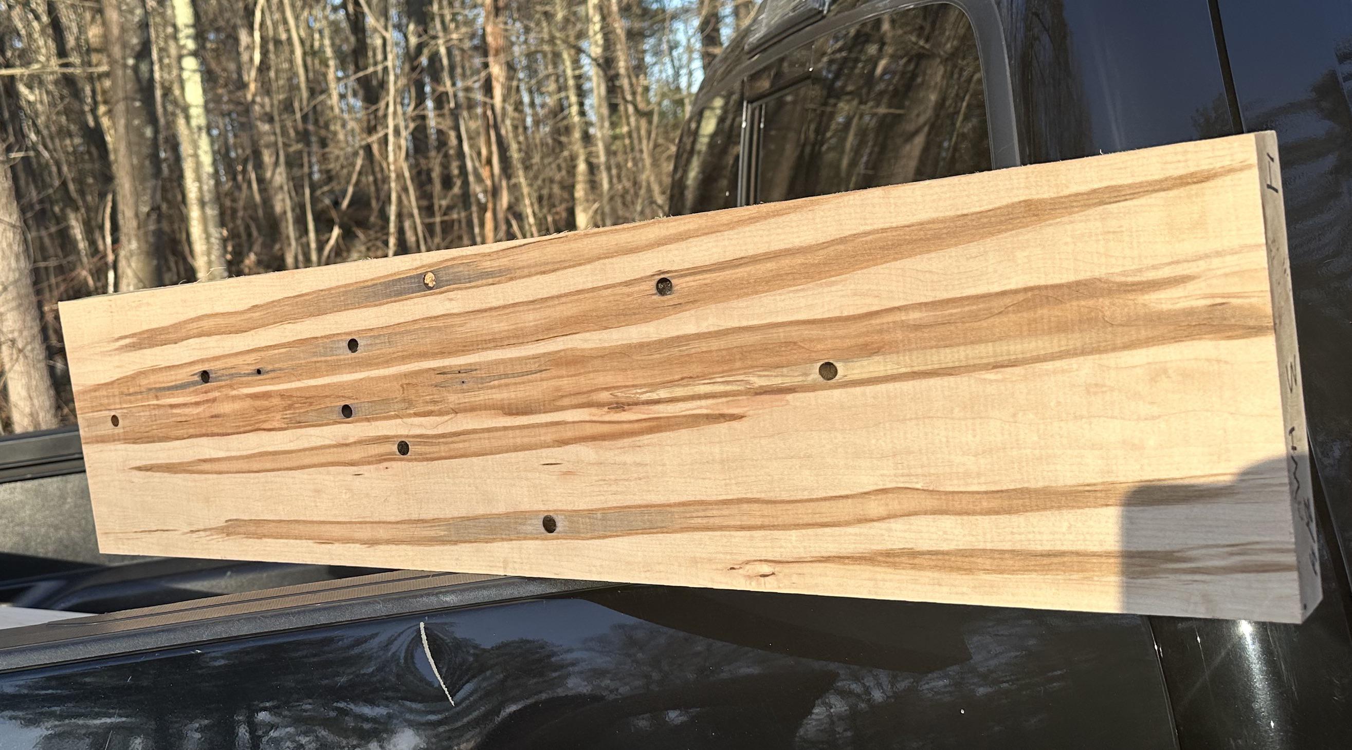 Lumber from a piece of sugar maple that has been tapped many times over ...