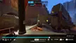 Overwatch gameplay of a Bastion player fighting an enemy robot in a desert canyon while escorting the payload.