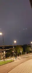 What are these flying flashlight like lights in the clouds?