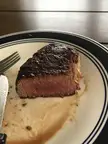 A beautiful medium rare on a pan fried filet mignon