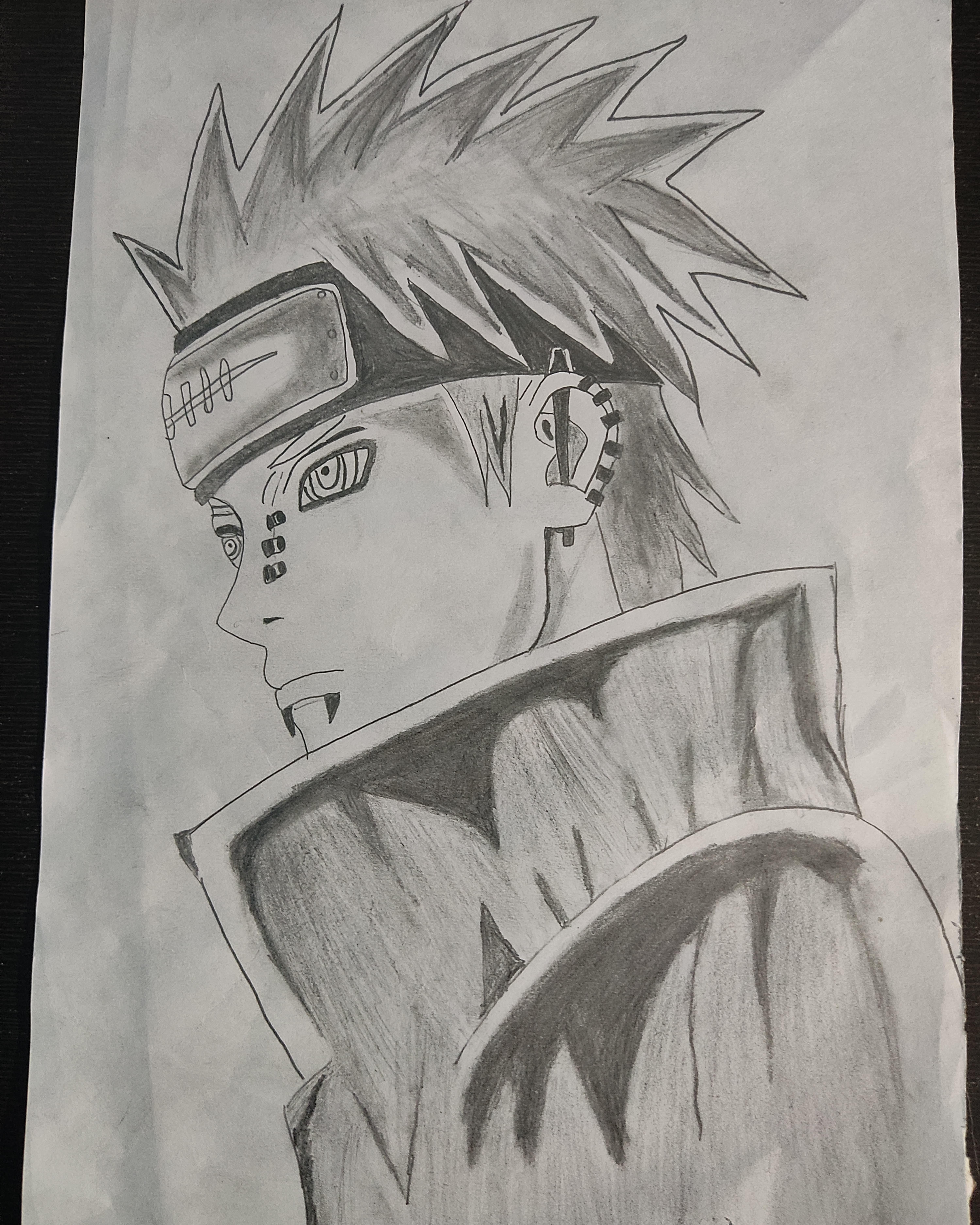 Naruto fan art pencil drawings of three characters with spiky hair, headbands, and high-collared jackets.