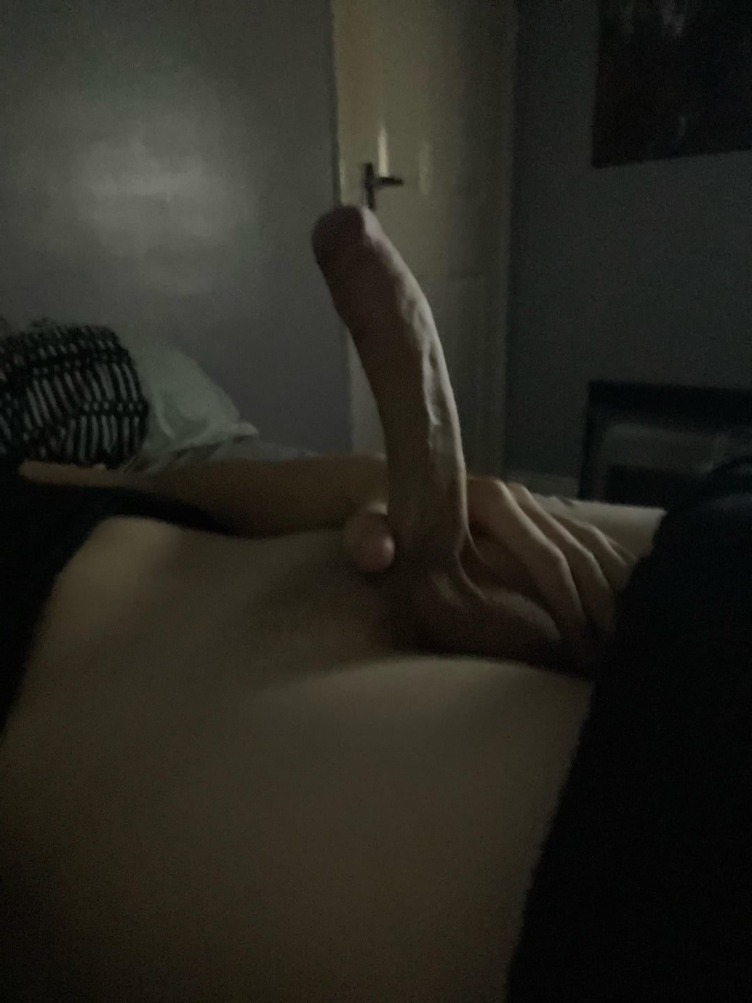 Slim white man with a big uncut cock and boner taking a pelfie in a bedroom