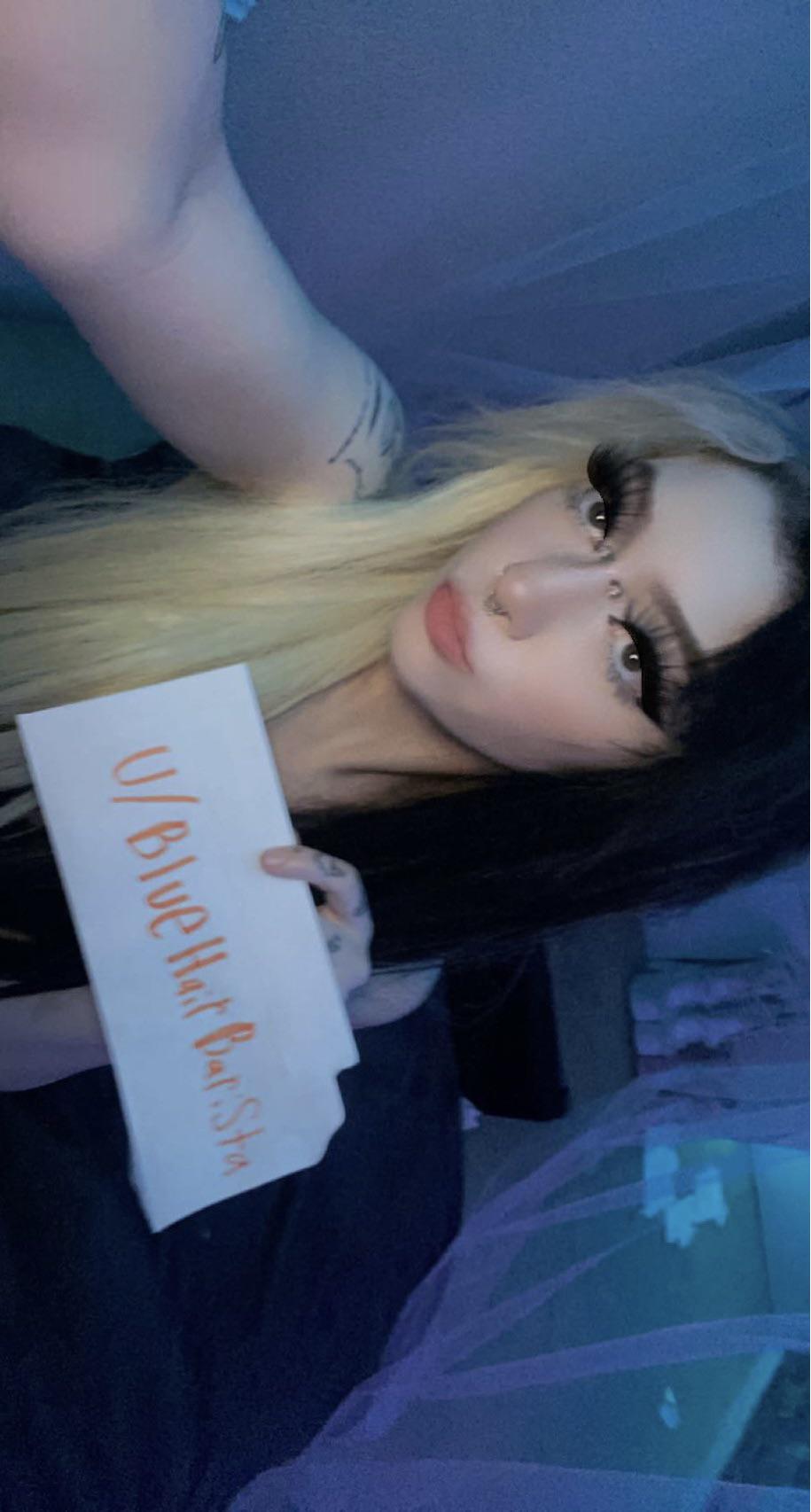 E-girl with split-dyed black and blonde hair and a black top