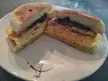 Breakfast sandwich japanese style folded egg with black beans, cheese, mayo and salsa