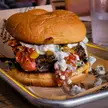 Burger w/ Feta cheese, roasted tomatoes, grilled yellow squash, sliced almonds, mixed greens &amp; tzatziki sauce at Morgantown Brewing Company, WV