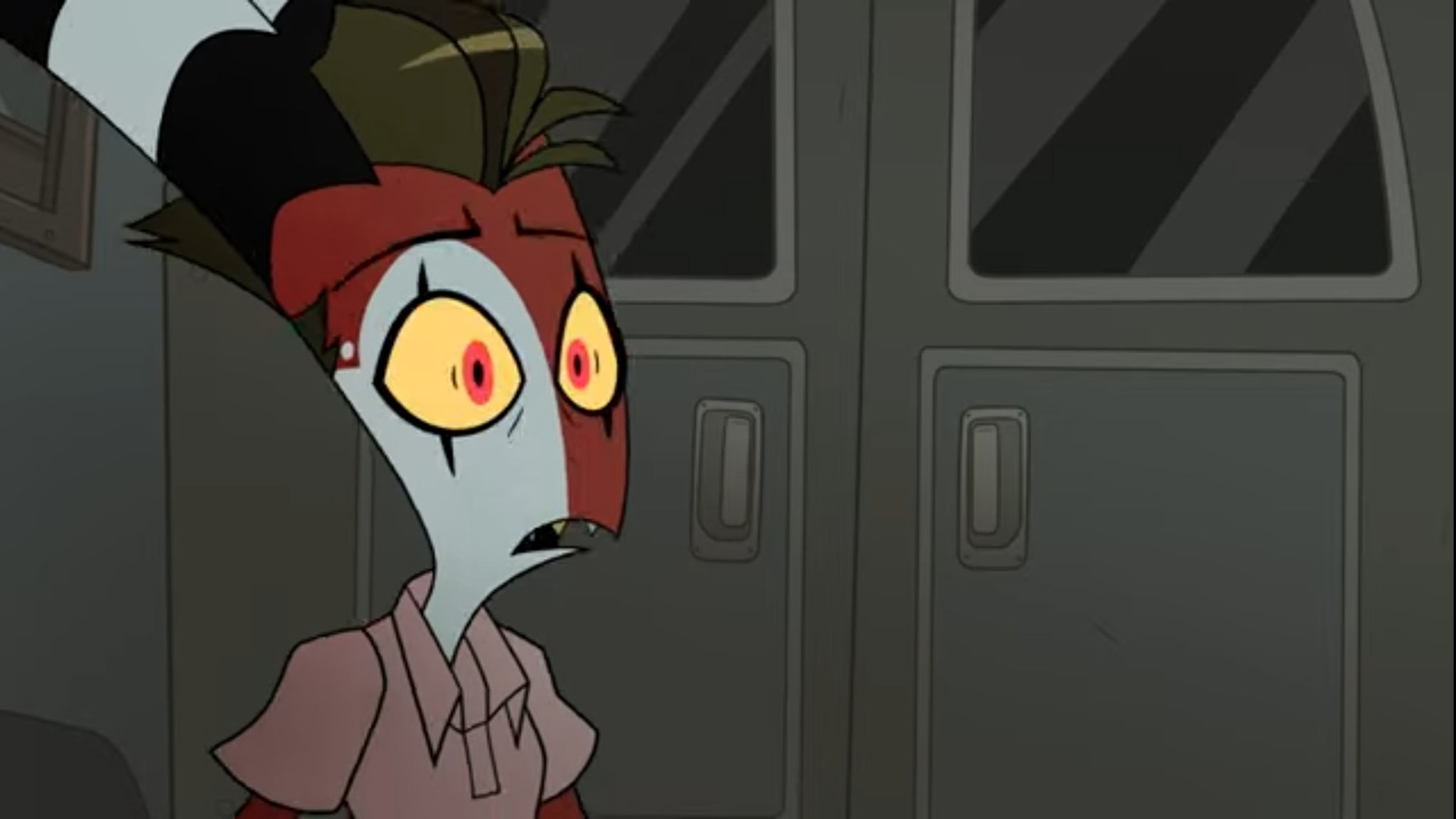 Blitzo from Hazbin Hotel with a scared, funny face, wearing a pink collared shirt in front of grey doors.