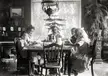 This photo is of a family at the dinner table. This is an upper middle class family judging by the decor and furniture. Photo was purchased fro ma seller in Illinois, but I’n not certain it is where it was taken. Taken circa early 1900s. From my glass negative collection.