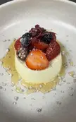 [homemade] white chocolate pannacotta, sugared berries and roasted white chocolate