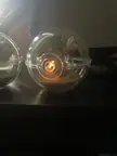 Cute Pokemon fan art of a small figure inside a clear plastic sphere with a glowing light effect.