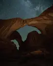 Double Arch beneath the night sky, Arches National Park [1600x2000][OC]