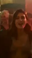 Kriti Sanon dancing on stage in silver and black costumes with backup dancers