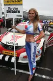 Tall grid girl is excited for the race to get started