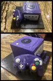 Nintendo GameCube cake I got for my friends birthday last year from a local bakery. Vanilla cake with buttercream filling. The controller os made of Rice crispy and fondant.