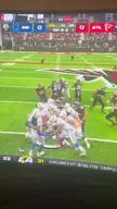 Madden video game football players in uniforms and helmets during a punt that results in a safety