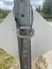 Metal key/tool on the back of road signs?