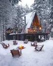 A-frame cabin surrounded by the winter forest in Adirondack Park near Lake Placid, the Adirondack Mountains, Upstate New York.