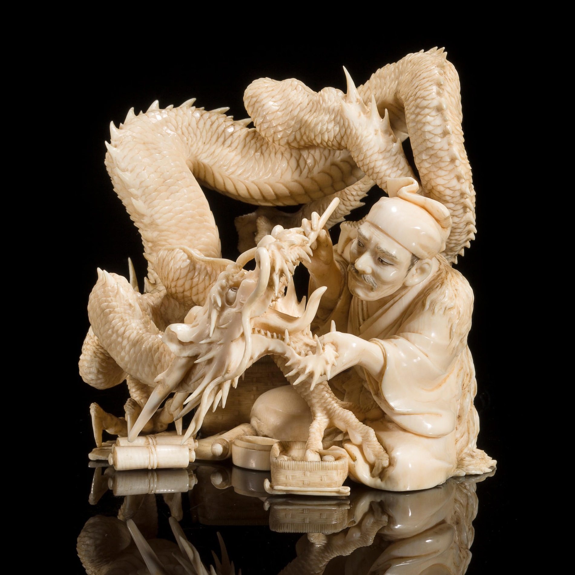 Ivory carving of a dentist treating a dragon. Japan, Meiji period, 19th century [1900x1900]