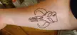 Got the Mandalorian Mythosaur symbol as my first tattoo