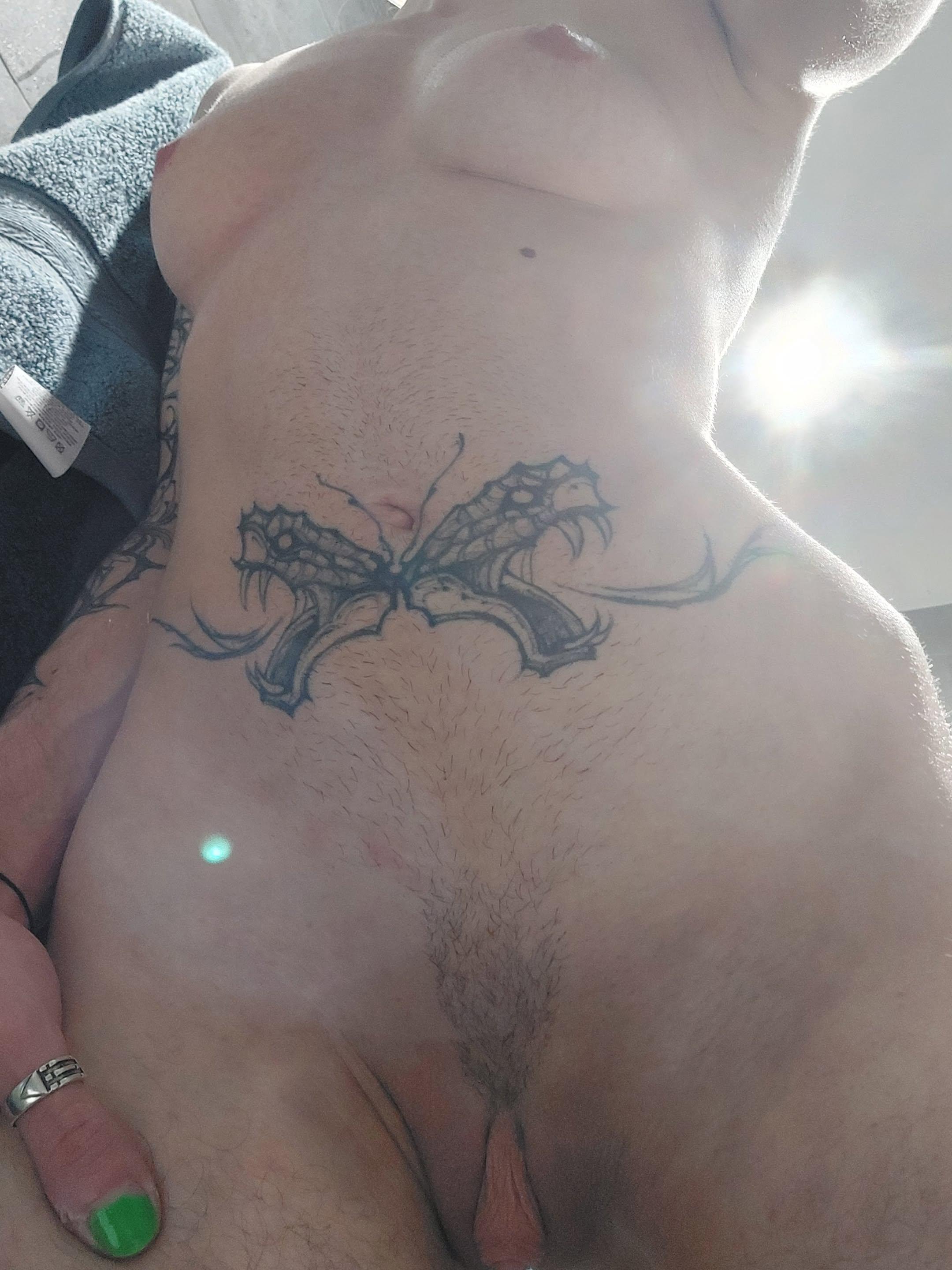 Slim white trans woman with a dragon tattoo on her lower abdomen posing for naked bathroom selfies