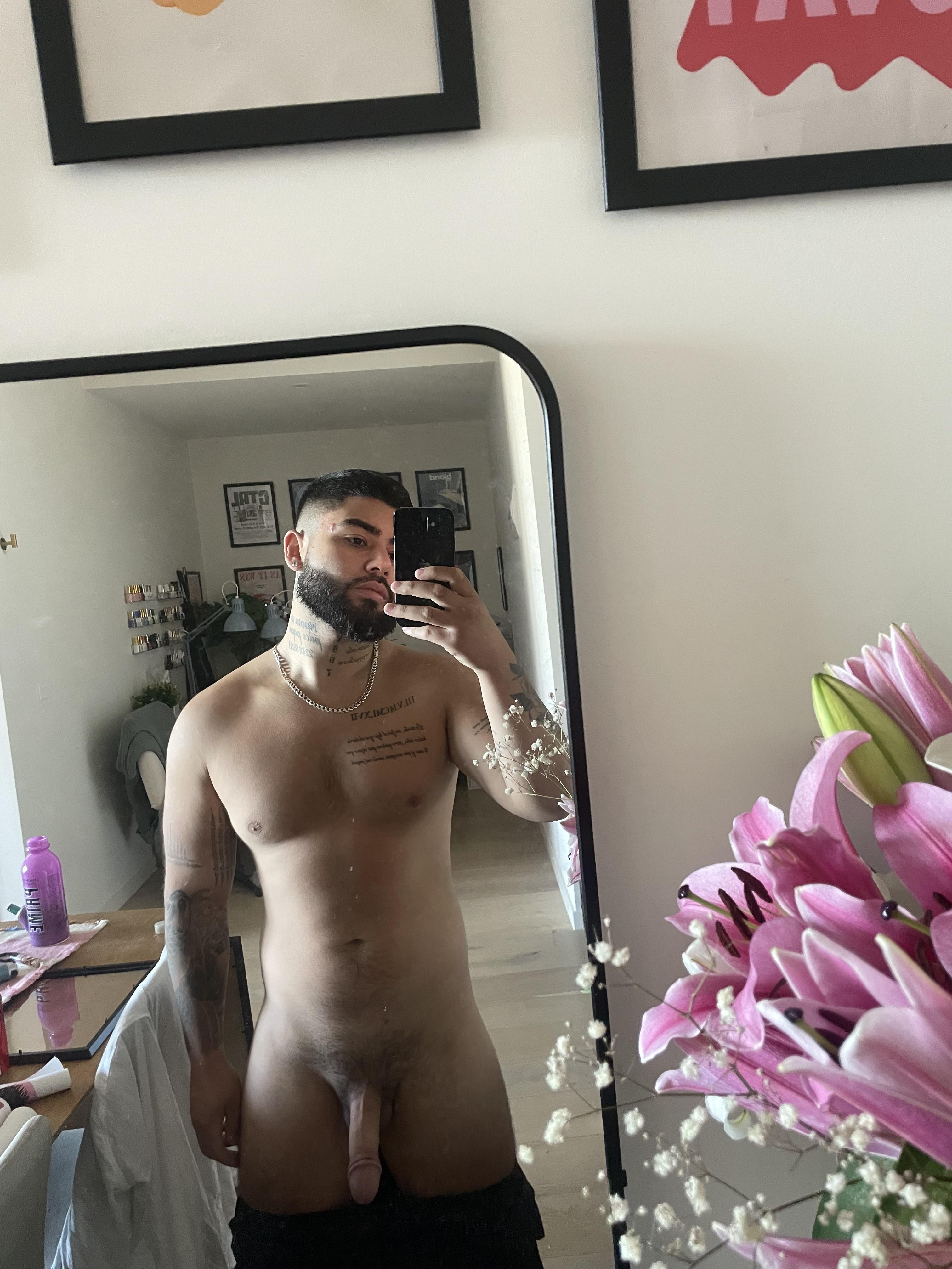 Athletic Latino man with tattoos posing for a pelfie and mirror selfie showing his big cock