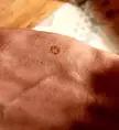 Accidentally touched a hot screw while pulling a pizza from the oven.