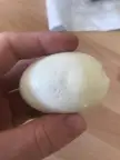 These small holes on my boiled egg - the rest of the egg is fine, no holes, and it smells fine and tastes fine. It was laid by our own chickens.