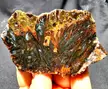 Magnificently toned needle forms and bluish tube formations on green botryoidal. Sagenated agate
