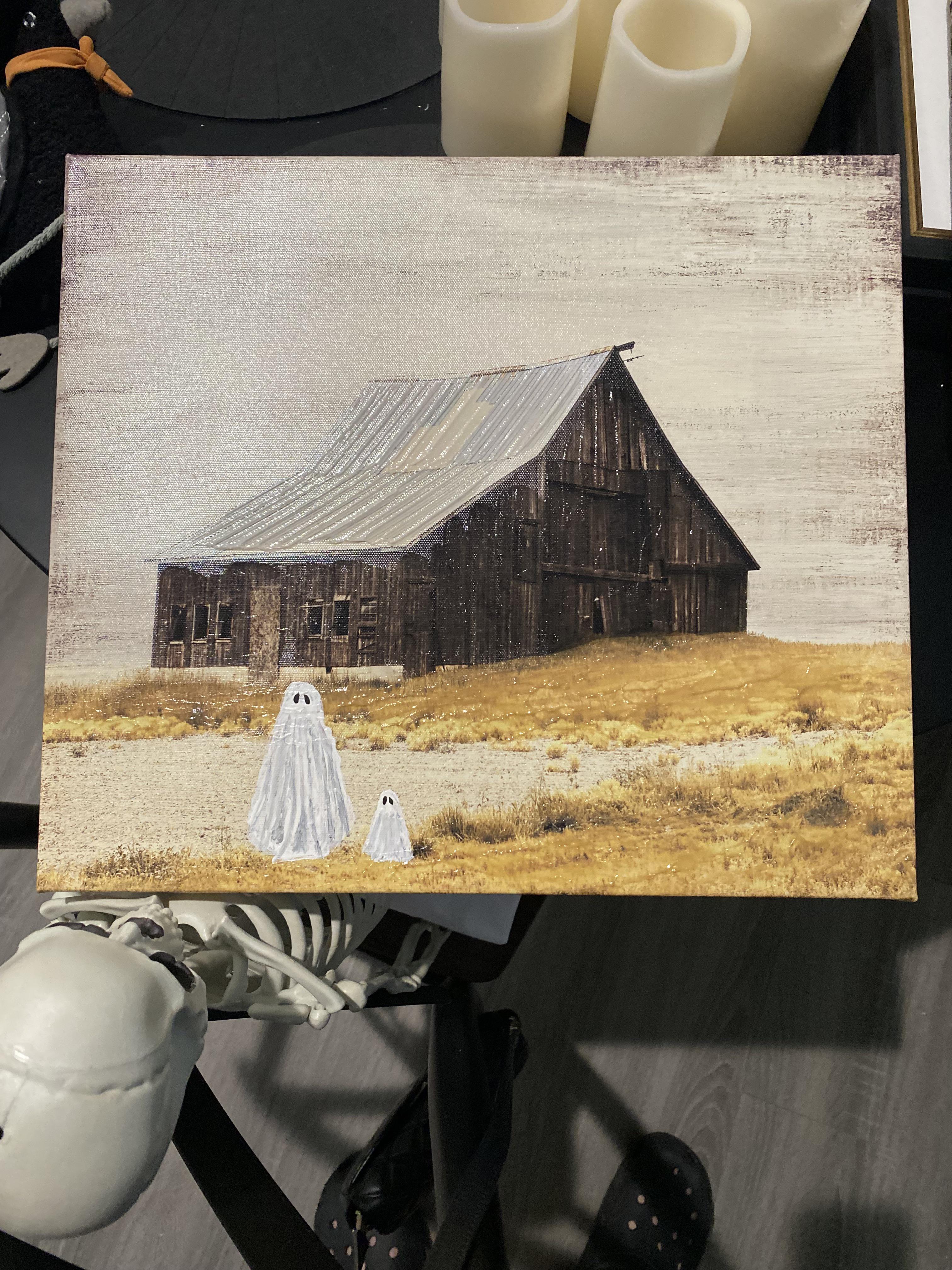Ghost painting trend art of a ghost figure in a black witch hat standing before a barn with a wreath
