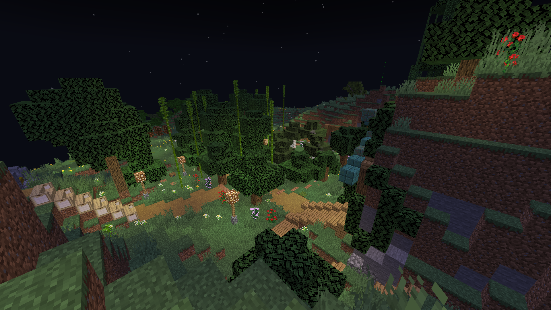 Minecraft survival builds featuring a base with flags, paths, and foliage in a beautiful landscape.