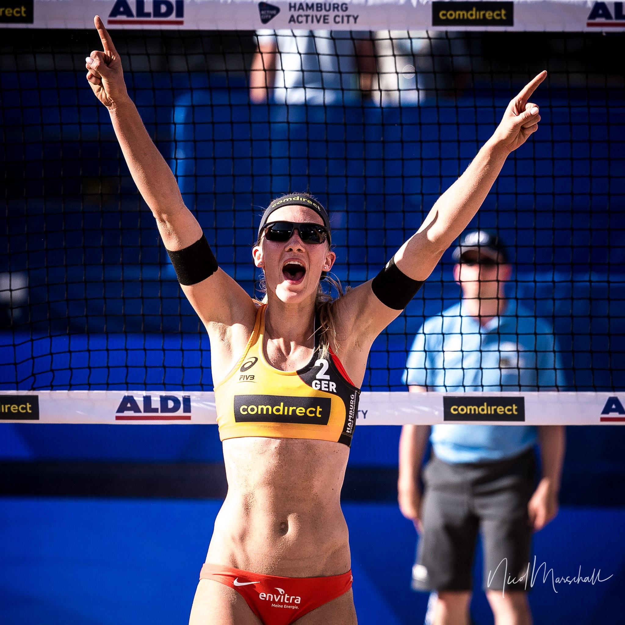 Sandra Ittlinger as a blonde volleyball girl in athletic wear and a black bikini