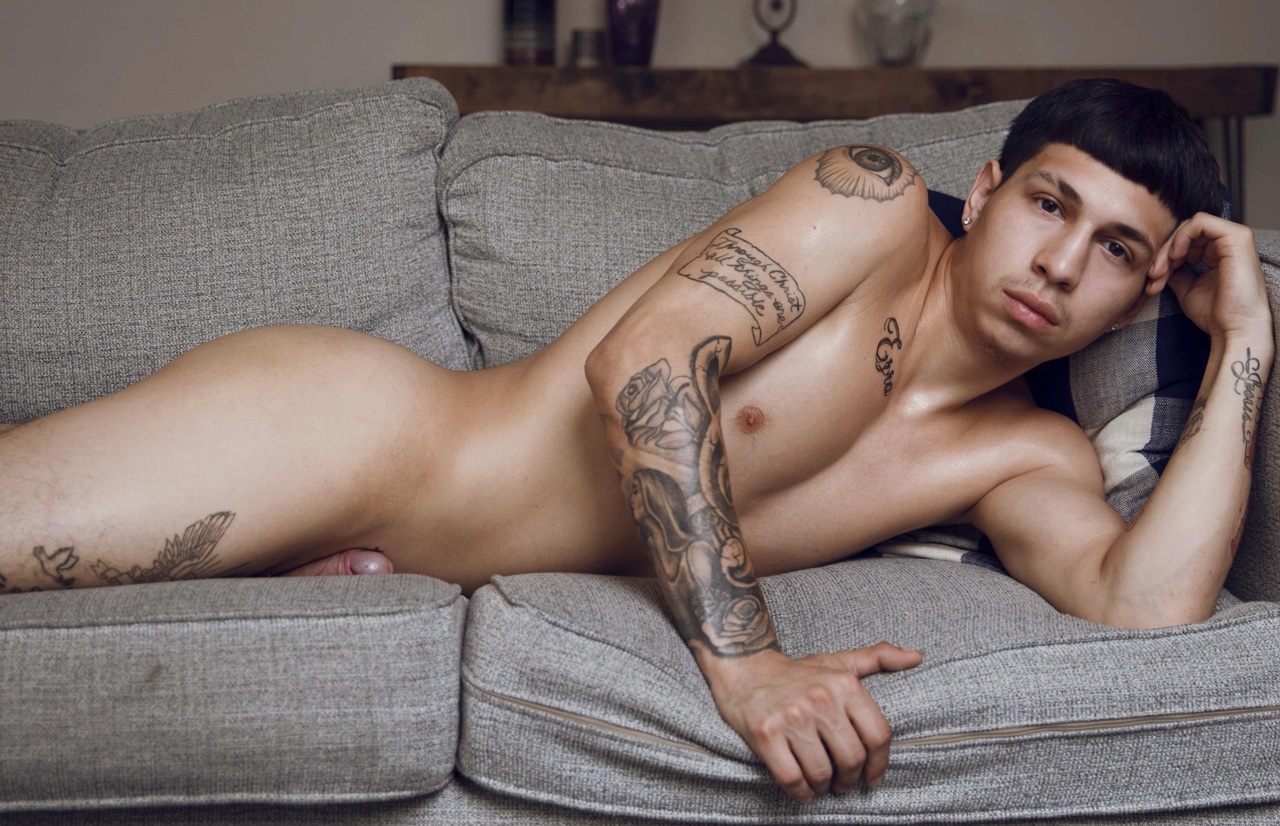 Muscular tattooed twunk in a maroon thong and nude posing with a curvy woman