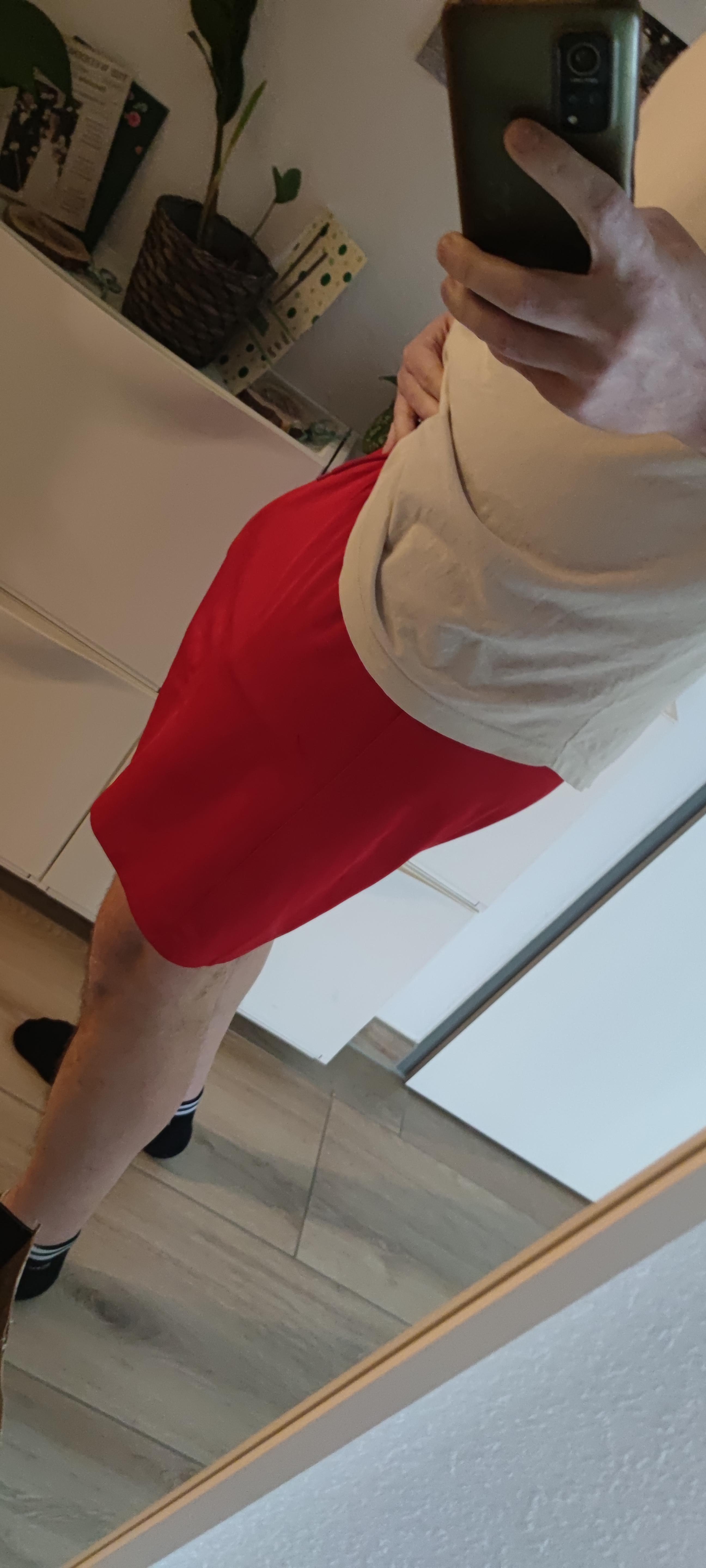 Muscular German daddy in a white tank top, basketball jersey, and black tank top posing for mirror selfies