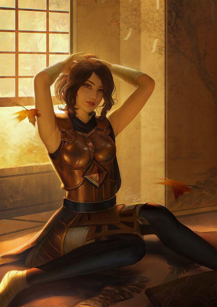INA WONG as a mixed athletic woman in bronze armor, sitting with arms up in a sunlit room