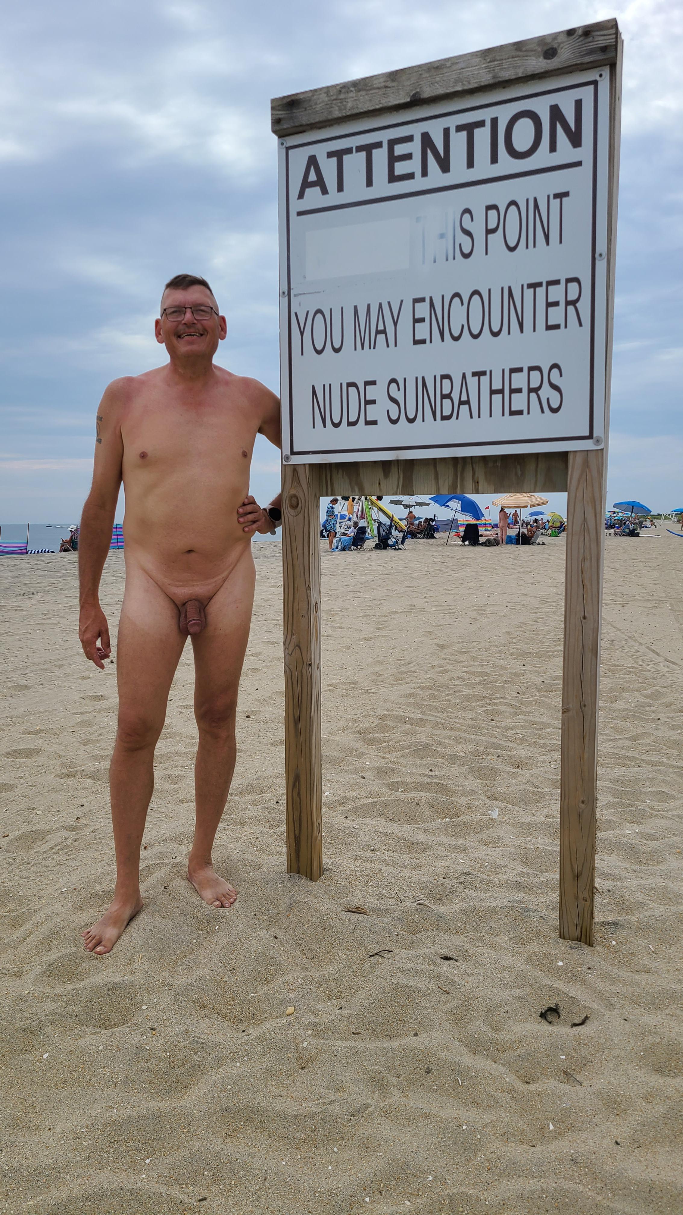 Athletic mature white man posing nude on a beach and boat, practicing naturism and FKK.