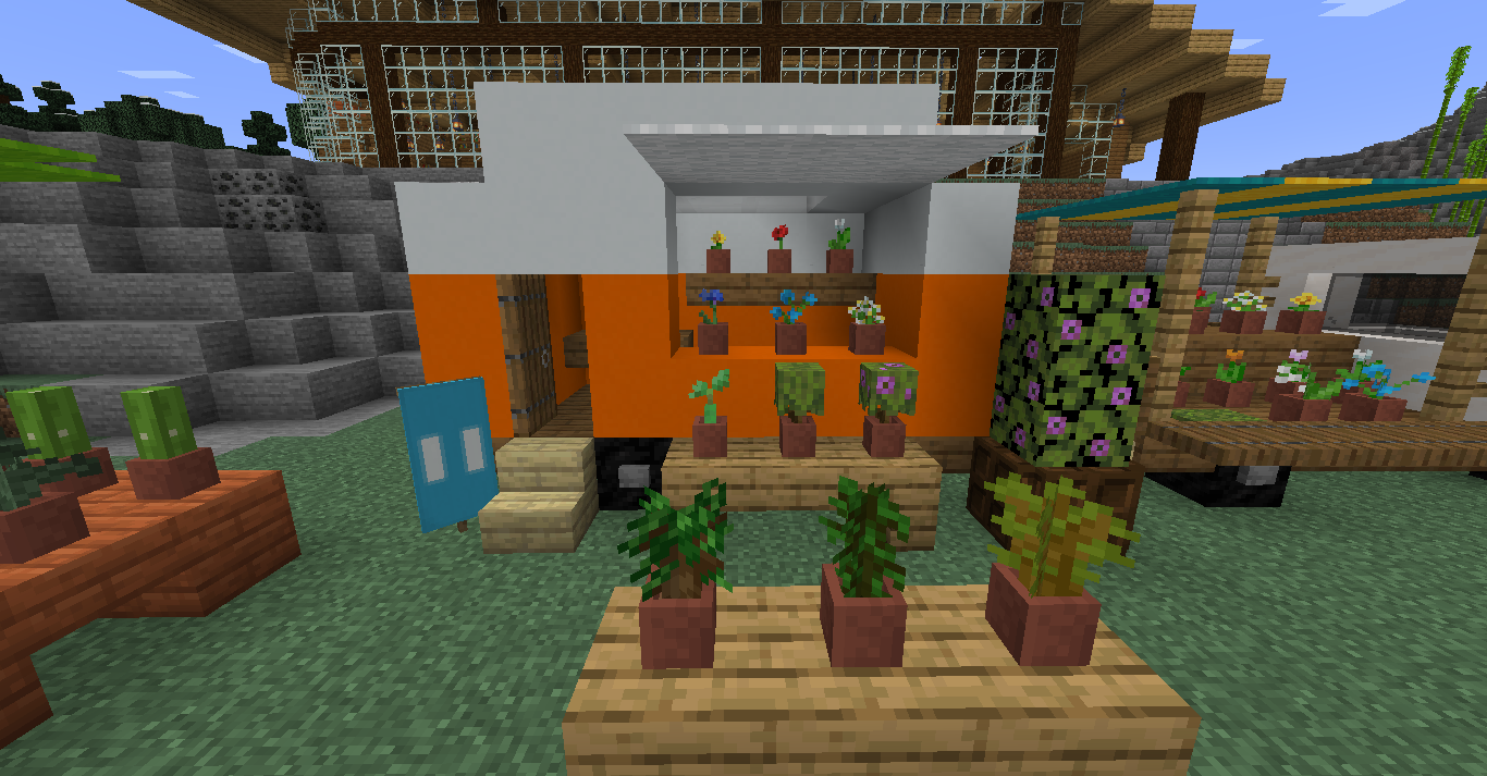 Cute small Minecraft builds of a flower shop with orange and white stalls and a FLOWERS sign