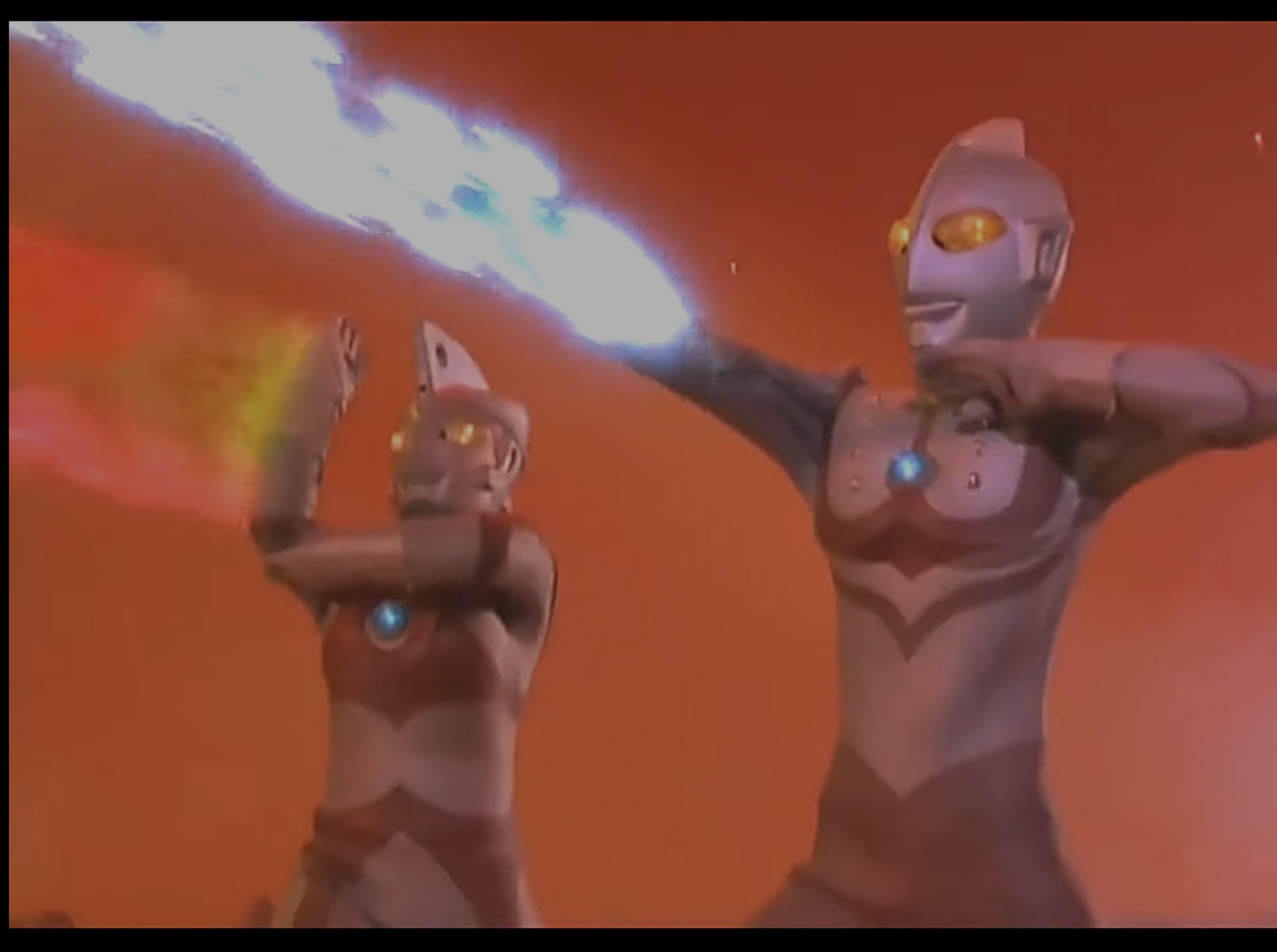 Zoffy, the strongest Ultra Brother, unleashing a massive energy blast against monsters in a rocky landscape.