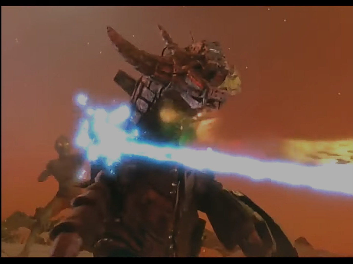 Zoffy, the strongest Ultra Brother, unleashing a massive energy blast against monsters in a rocky landscape.