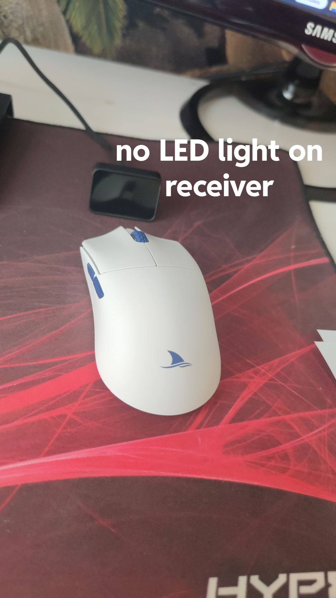 Darmoshark M3 4k gaming mouse and USB receiver on a pc gaming desk setup with software screenshots
