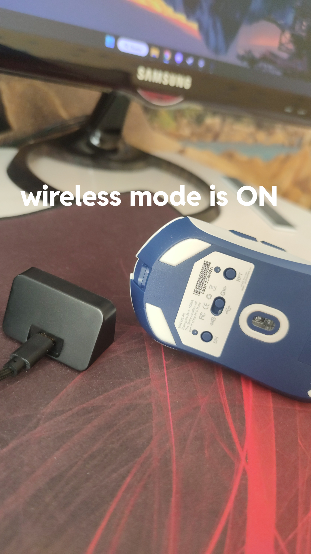 Darmoshark M3 4k gaming mouse and USB receiver on a pc gaming desk setup with software screenshots