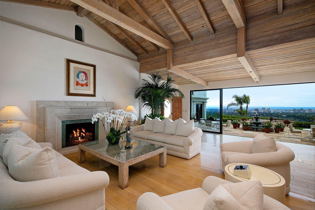 Lebron James luxury estate featuring a tennis court, swimming pool, living room, and home theater